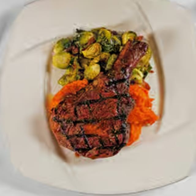 16oz Tomahawk Bone-In Pork Chop.